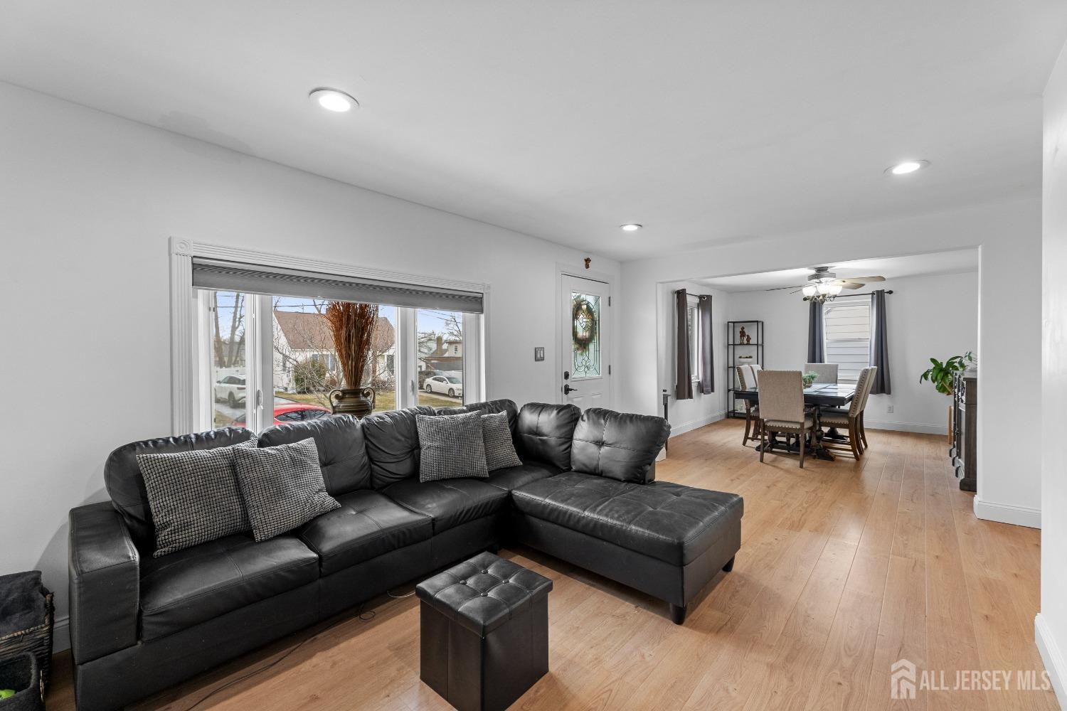 27 George Street Avenel, NJ 07001 - Photo 8 of 36 a living room with furniture and a large window