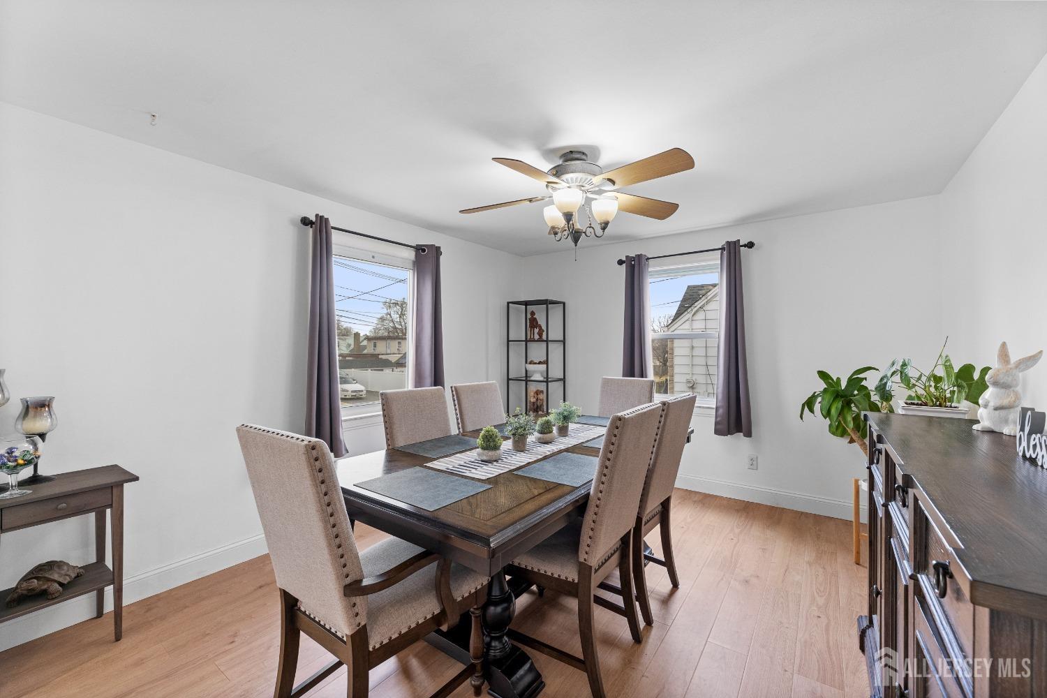 27 George Street Avenel, NJ 07001 - Photo 9 of 36 a view of a dining room with furniture window and wooden floor