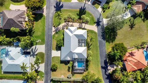 an aerial view of residential houses with outdoor space