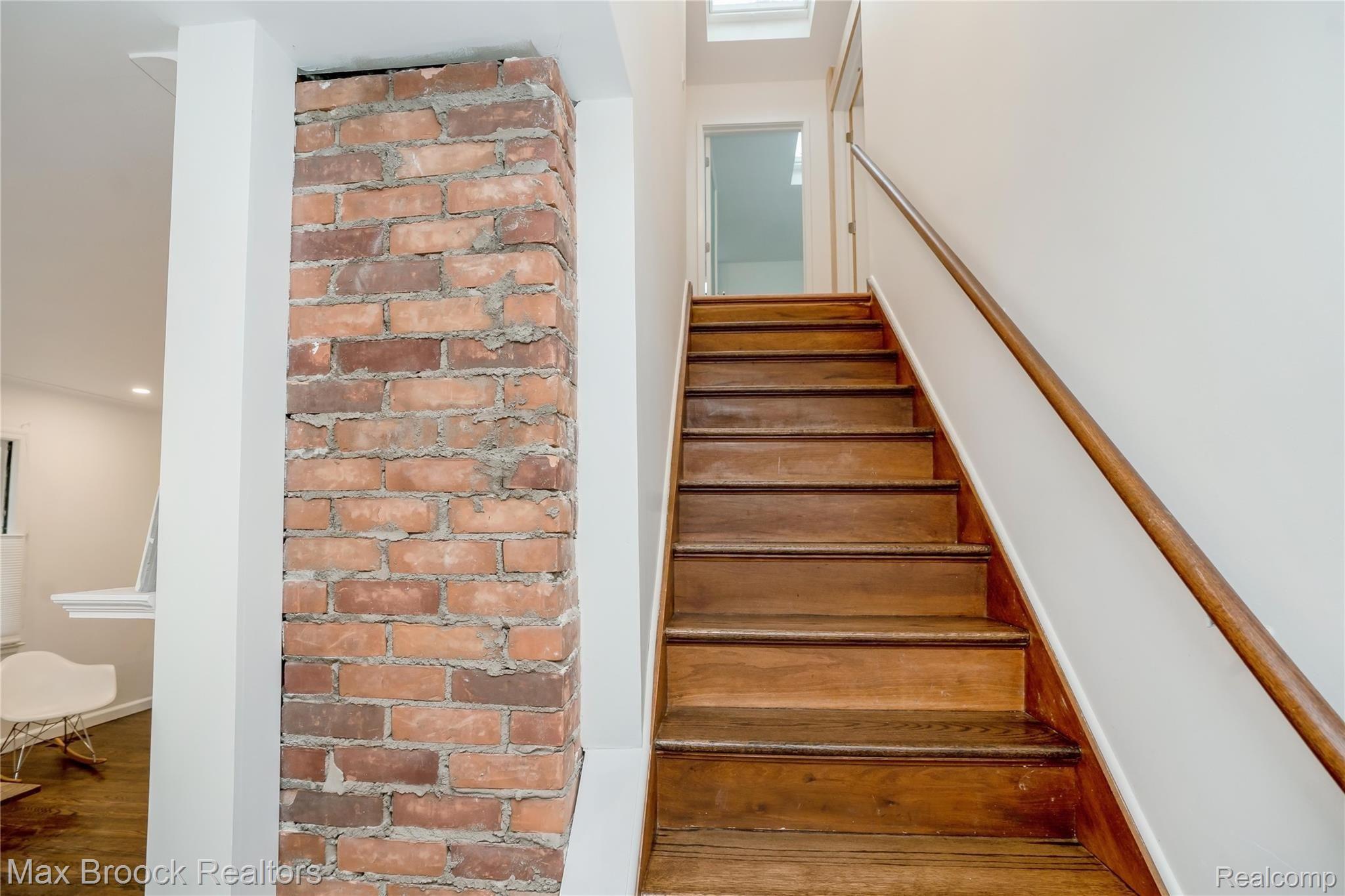 90 Amherst Road Pleasant Ridge, MI 48069 - Photo 21 of 43 Exposed brick and stairs leading to second floor