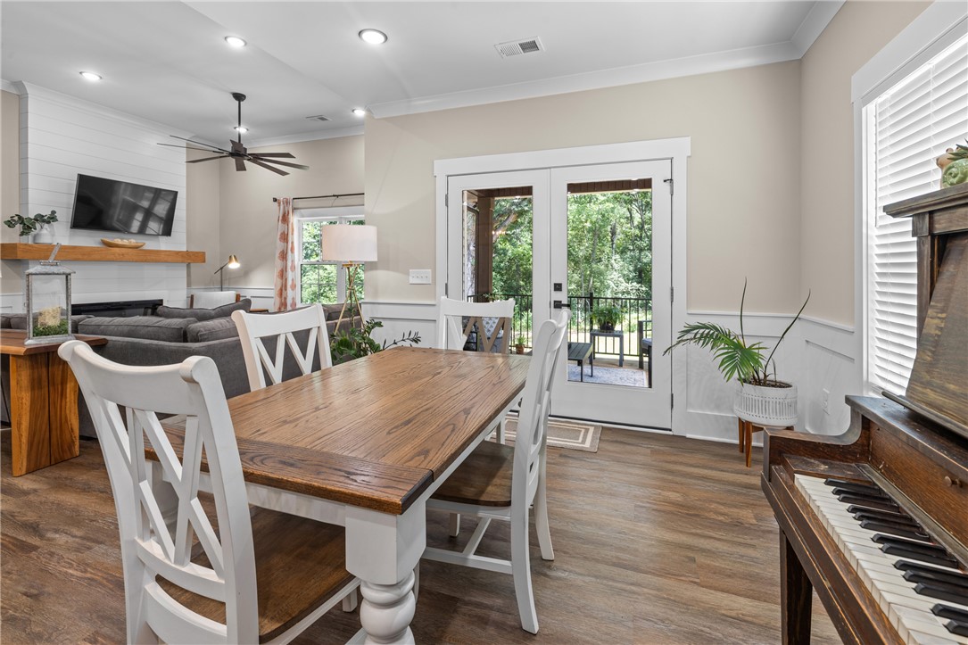 322 Thompson Street Pendleton, SC 29670 - Photo 9 of 38 Gleaming floors and classic wainscoting highlight this inviting dining space opening to the living room.