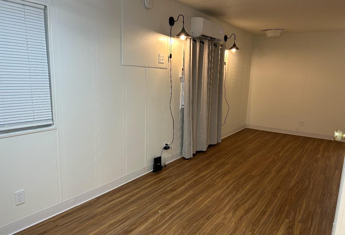 40845 Jean Road East Oakhurst, CA 93644 - Photo 4 of 16 a view of a room with wooden floor and white walls