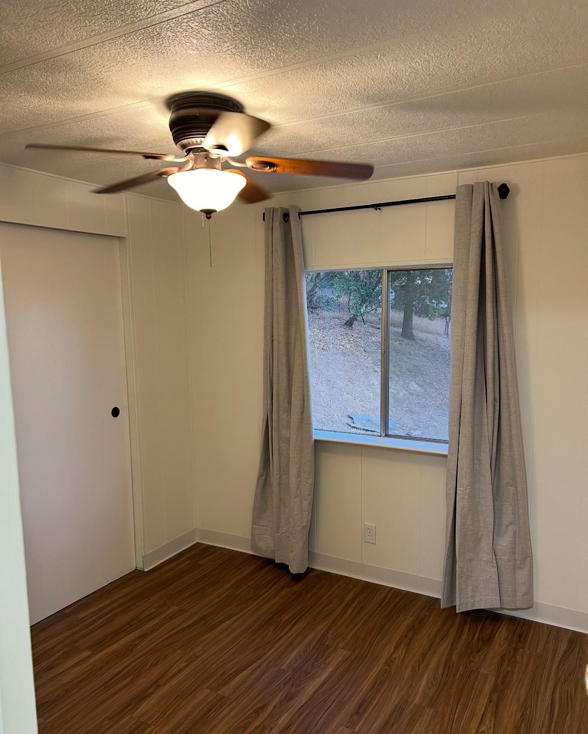 40845 Jean Road East Oakhurst, CA 93644 - Photo 8 of 16 a view of empty room with wooden floor