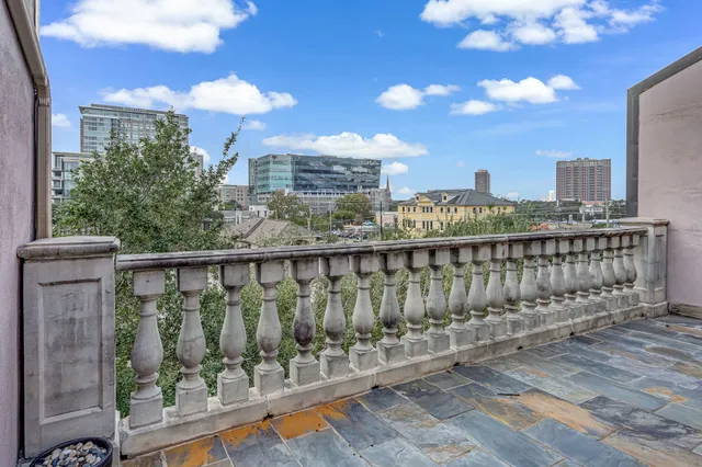 a view of a balcony with city view