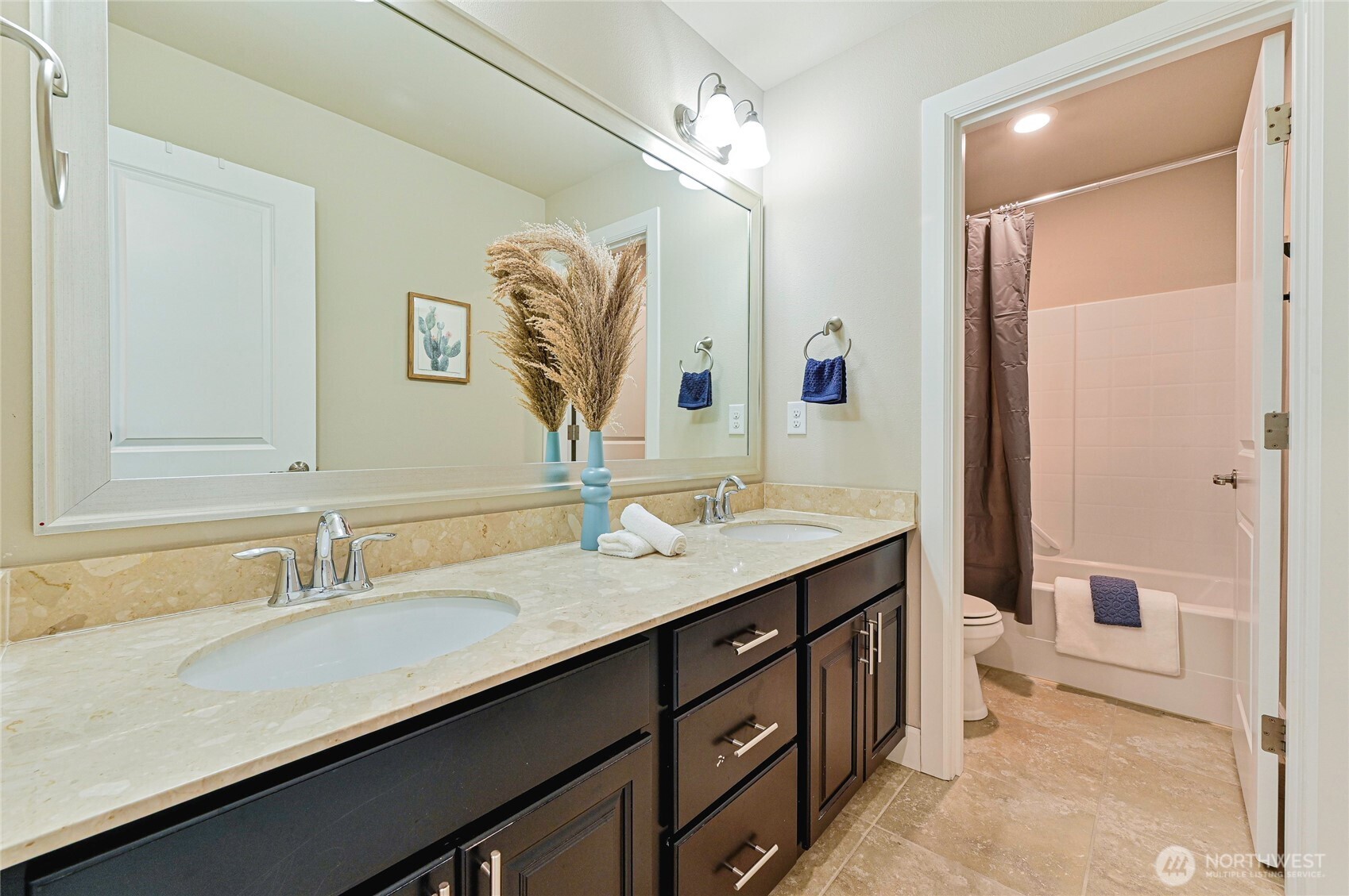17312 40th Avenue Southeast Bothell, WA 98012 - Photo 27 of 34 a bathroom with a granite countertop sink and a mirror