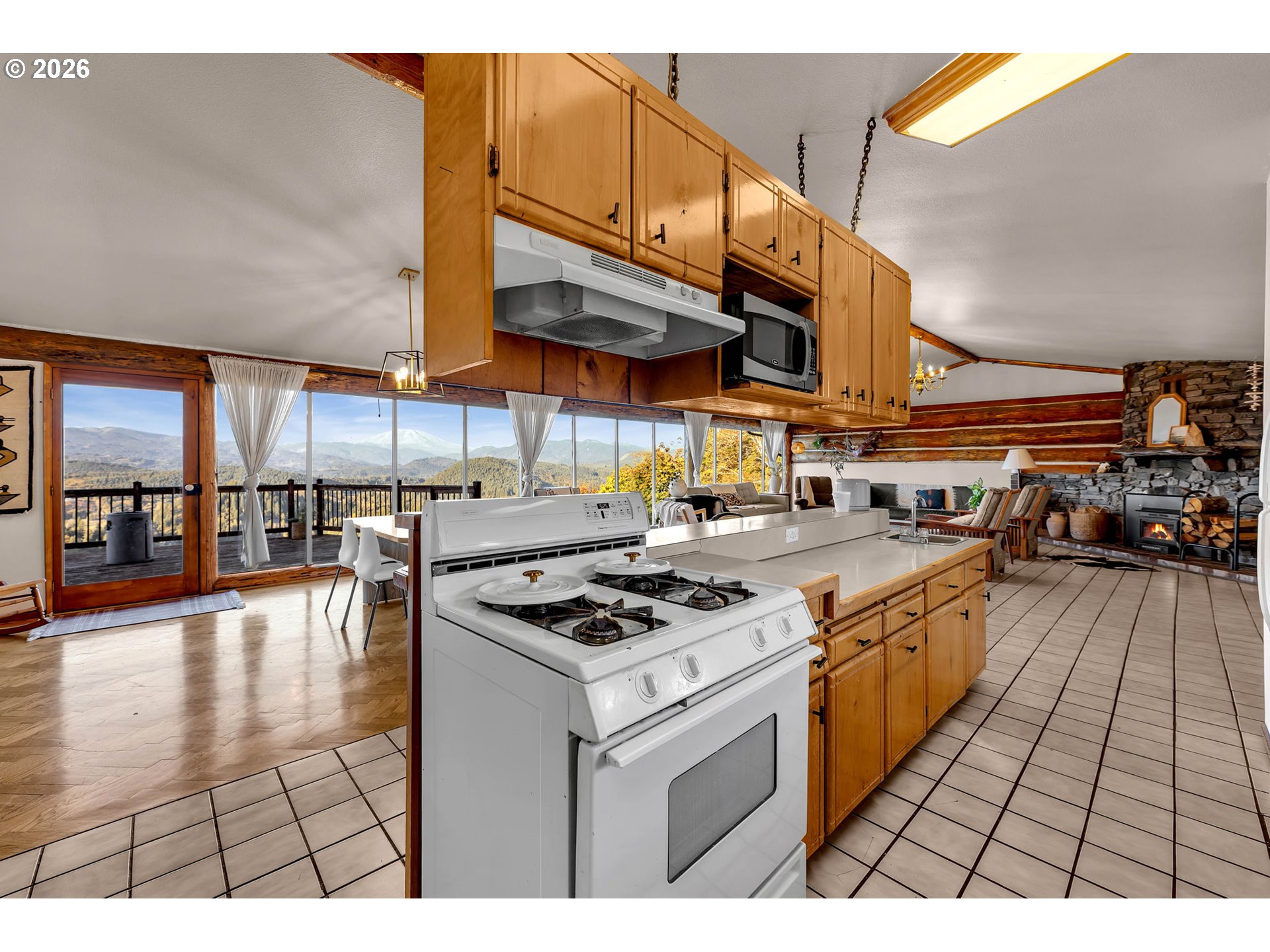 39904 Northeast Rotschy Road Yacolt, WA 98675 - Photo 15 of 48 a kitchen with stainless steel appliances granite countertop a stove a sink dishwasher and cabinets with wooden floor