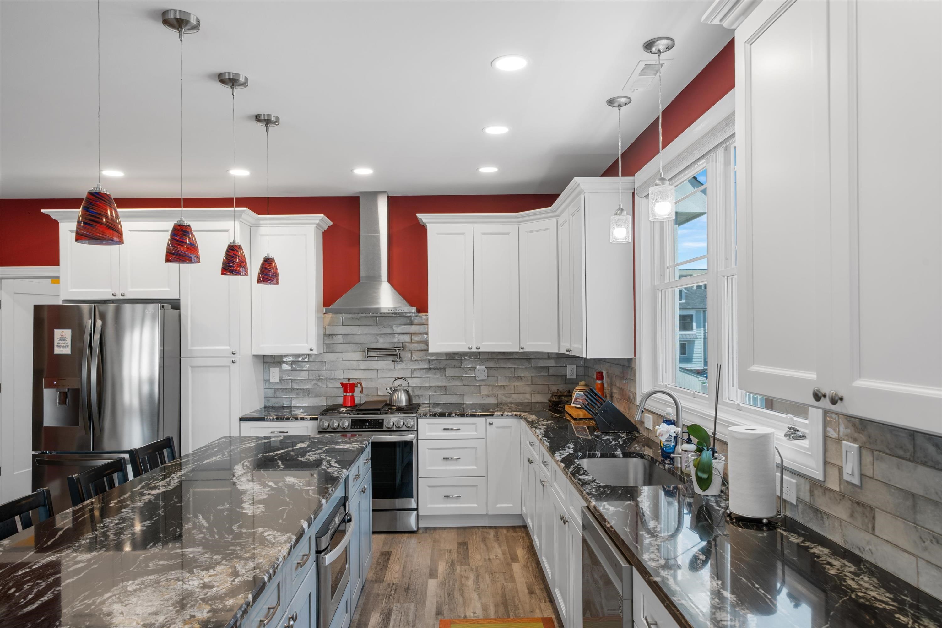 305 East Stockton Road Wildwood Crest, NJ 08260 - Photo 14 of 28 a kitchen with stainless steel appliances granite countertop a sink stove and refrigerator