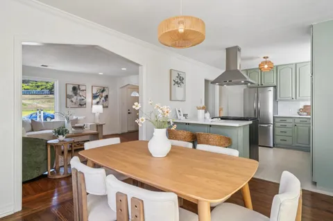 a dining room with furniture and chandelier