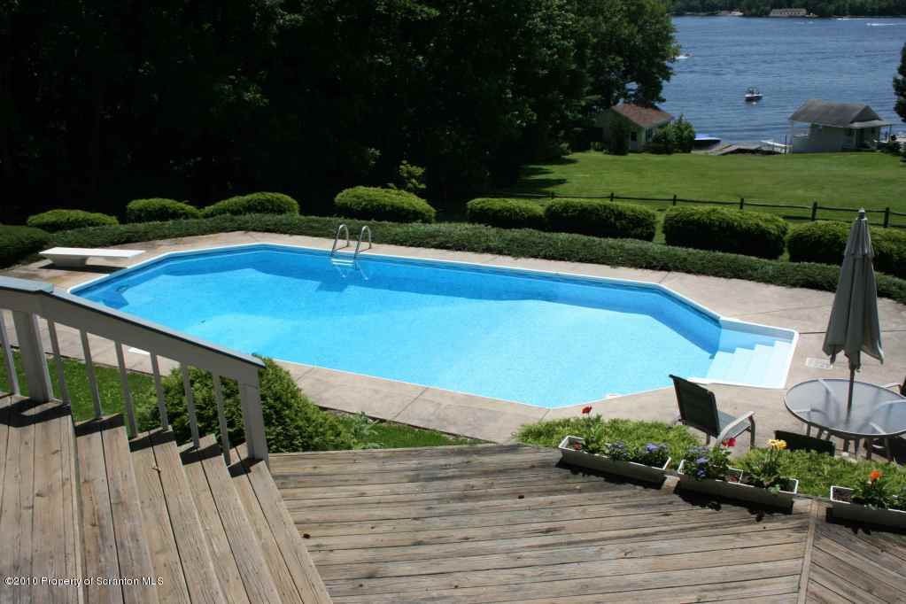 Rr1 Rr1 Road Factoryville, PA 18419 - Photo 3 of 19 a view of swimming pool outdoor seating and lake