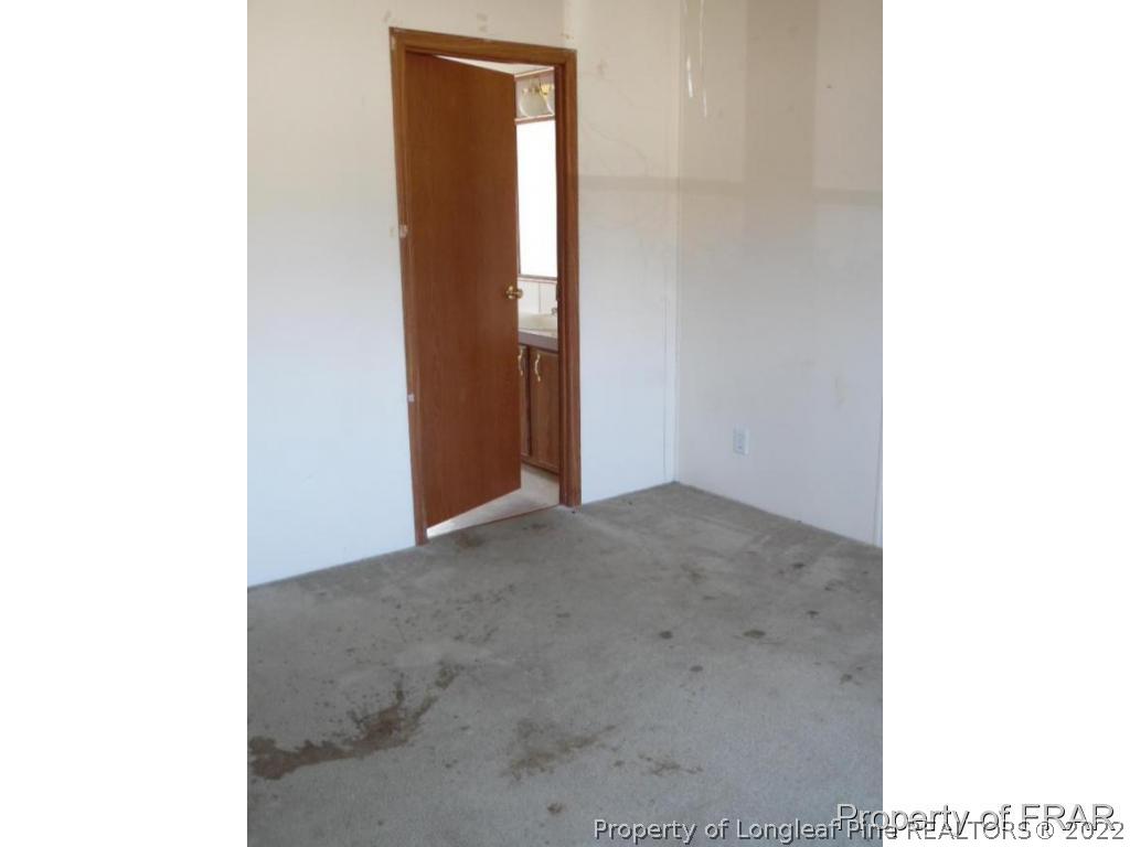 4832 Backbay Road Fayetteville, NC 28306 - Photo 12 of 18 a view of a room with a hallway
