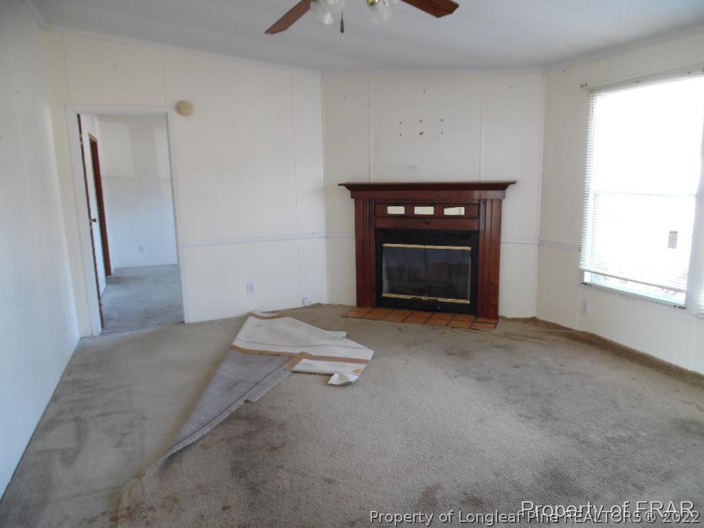 4832 Backbay Road Fayetteville, NC 28306 - Photo 6 of 18 a view of empty room with a fireplace