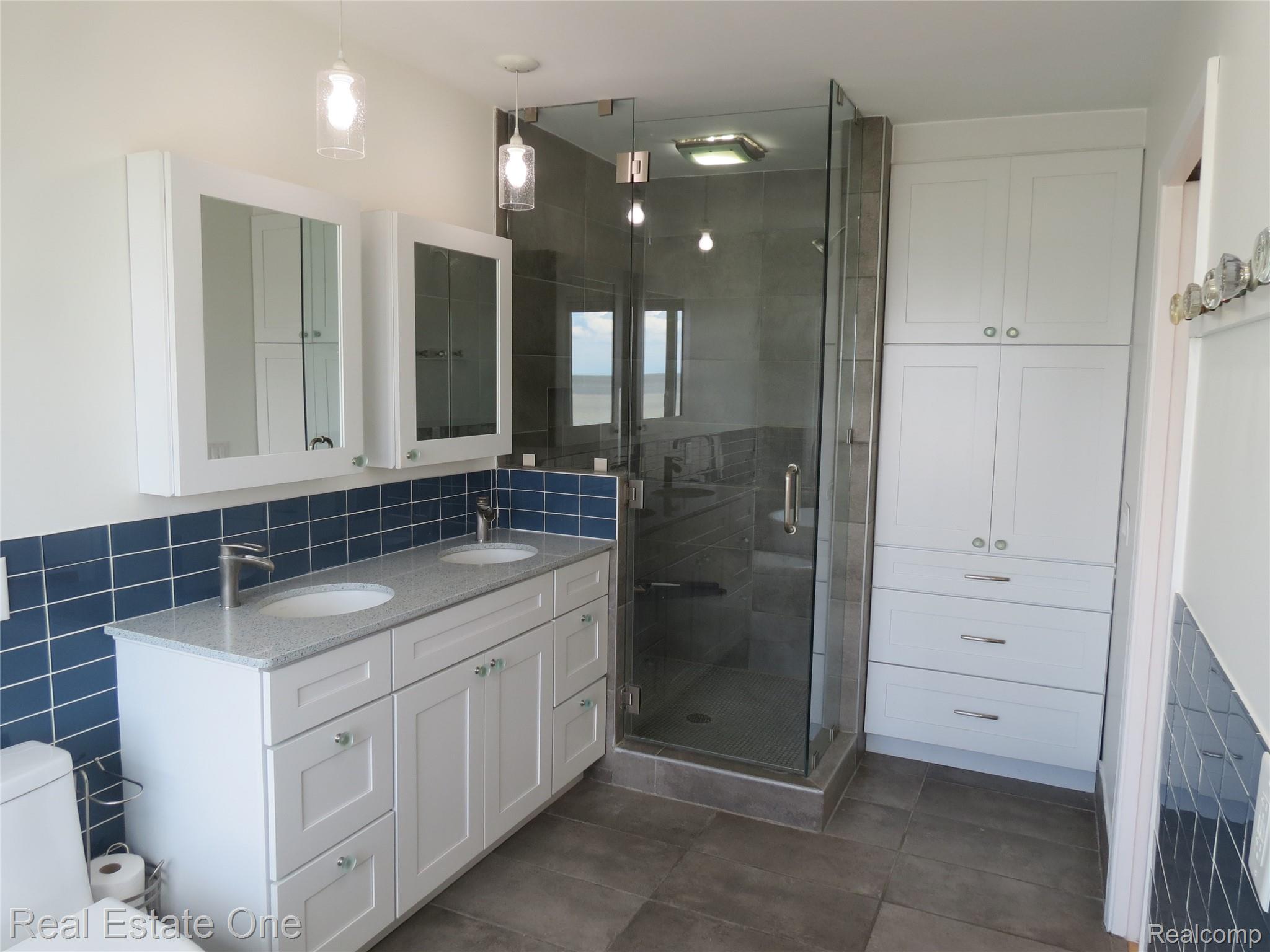 4583 Allen Cove Road Luna Pier, MI 48157 - Photo 33 of 50 Dual sink vanity and free standing shower.