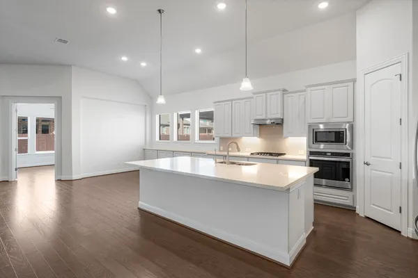 a living room with couches and a coffee table