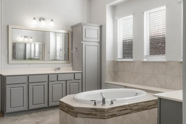 a bathroom with a bathtub and a shower
