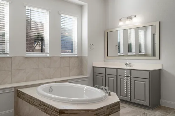 a bathroom with a shower and a sink