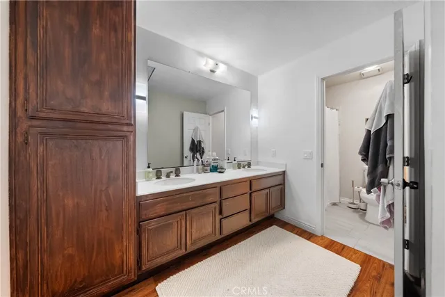 a bathroom with a tub sink and mirror