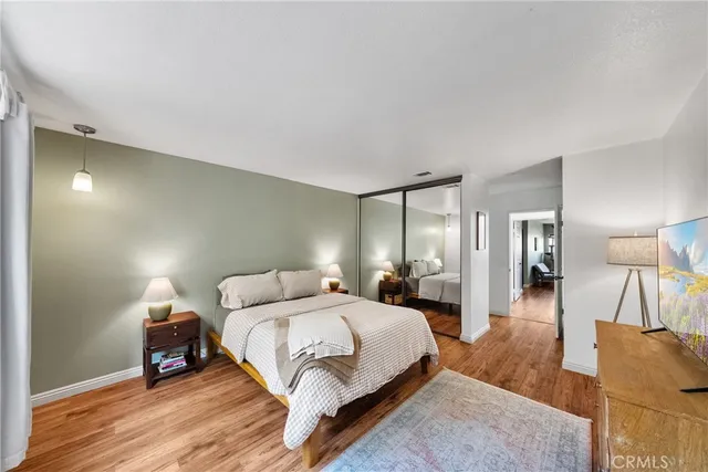 a spacious bedroom with a bed and a couch