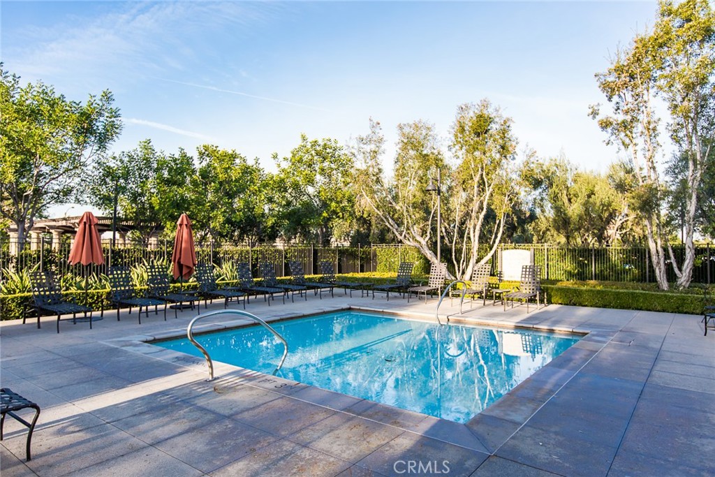75 Gardenstone Path Irvine, CA 92620 - Photo 51 of 65 a view of a swimming pool with a patio