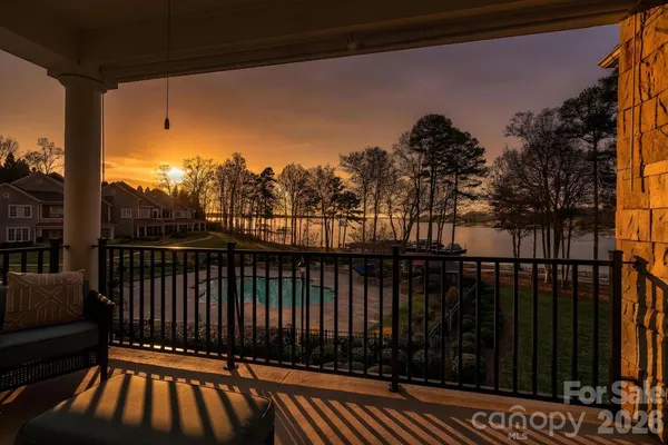 a view of a balcony with wooden floor