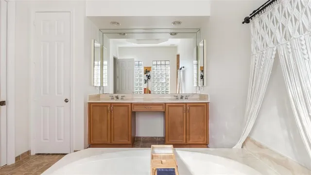a living room with furniture and a glass door shower