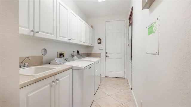 a view of a house with swimming pool and sitting area