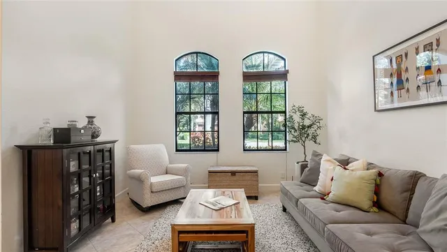 a view of a room with furniture and a chandelier