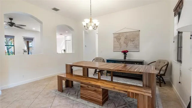 a room that has a bed and a table in it