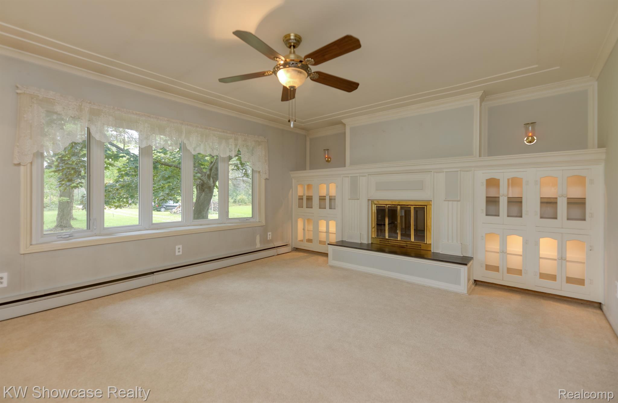 9536 Spencer Road South Lyon, MI 48178 - Photo 9 of 43 LIVING ROOM VIEW WITH 2 SIDED FIRE PLACE