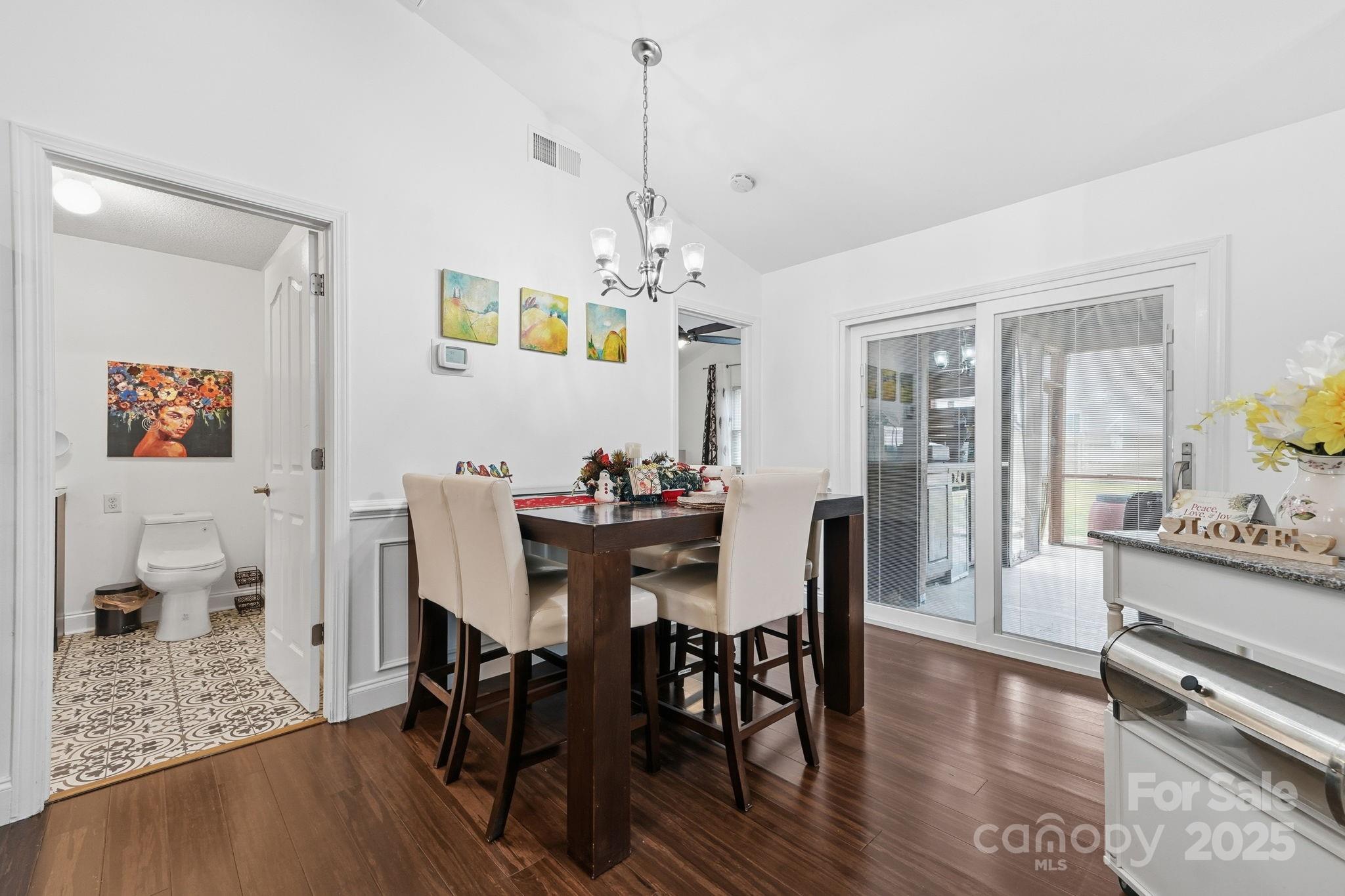 13512 Michael Lynn Road Charlotte, NC 28278 - Photo 12 of 36 a view of a dining room with furniture and wooden floor