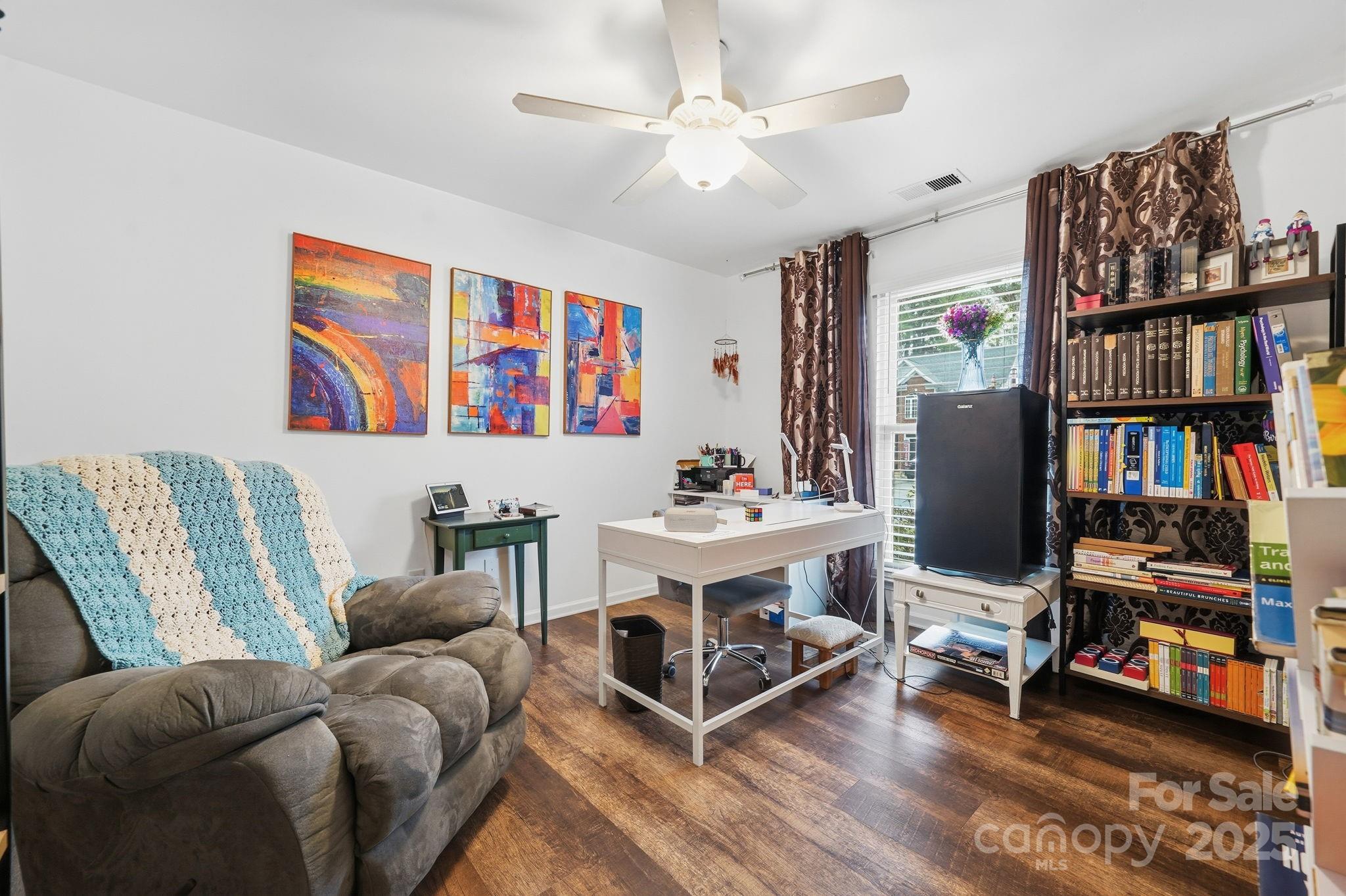 13512 Michael Lynn Road Charlotte, NC 28278 - Photo 15 of 36 a living room with furniture and a book shelf