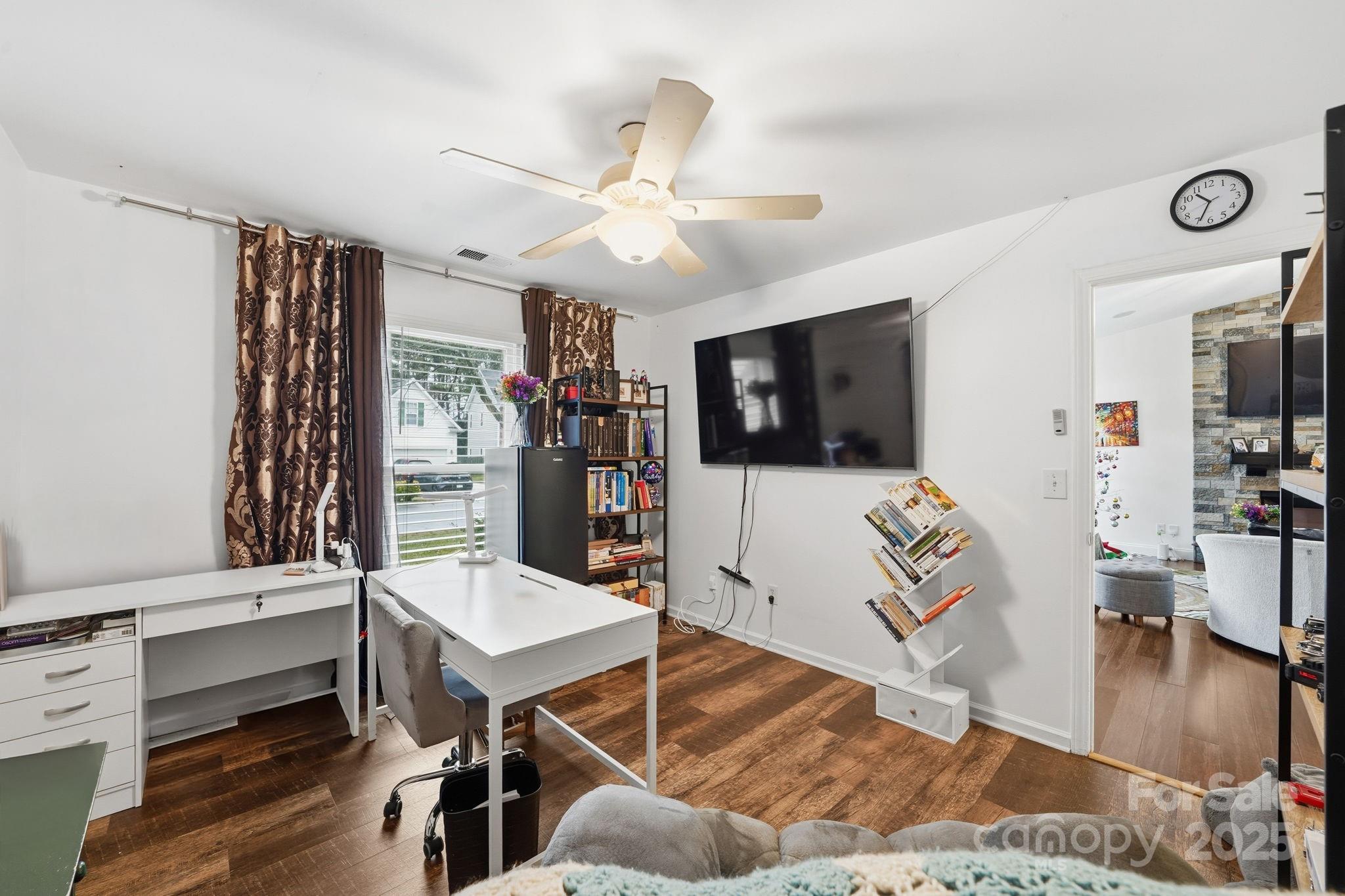 13512 Michael Lynn Road Charlotte, NC 28278 - Photo 16 of 36 a living room with furniture and a flat screen tv