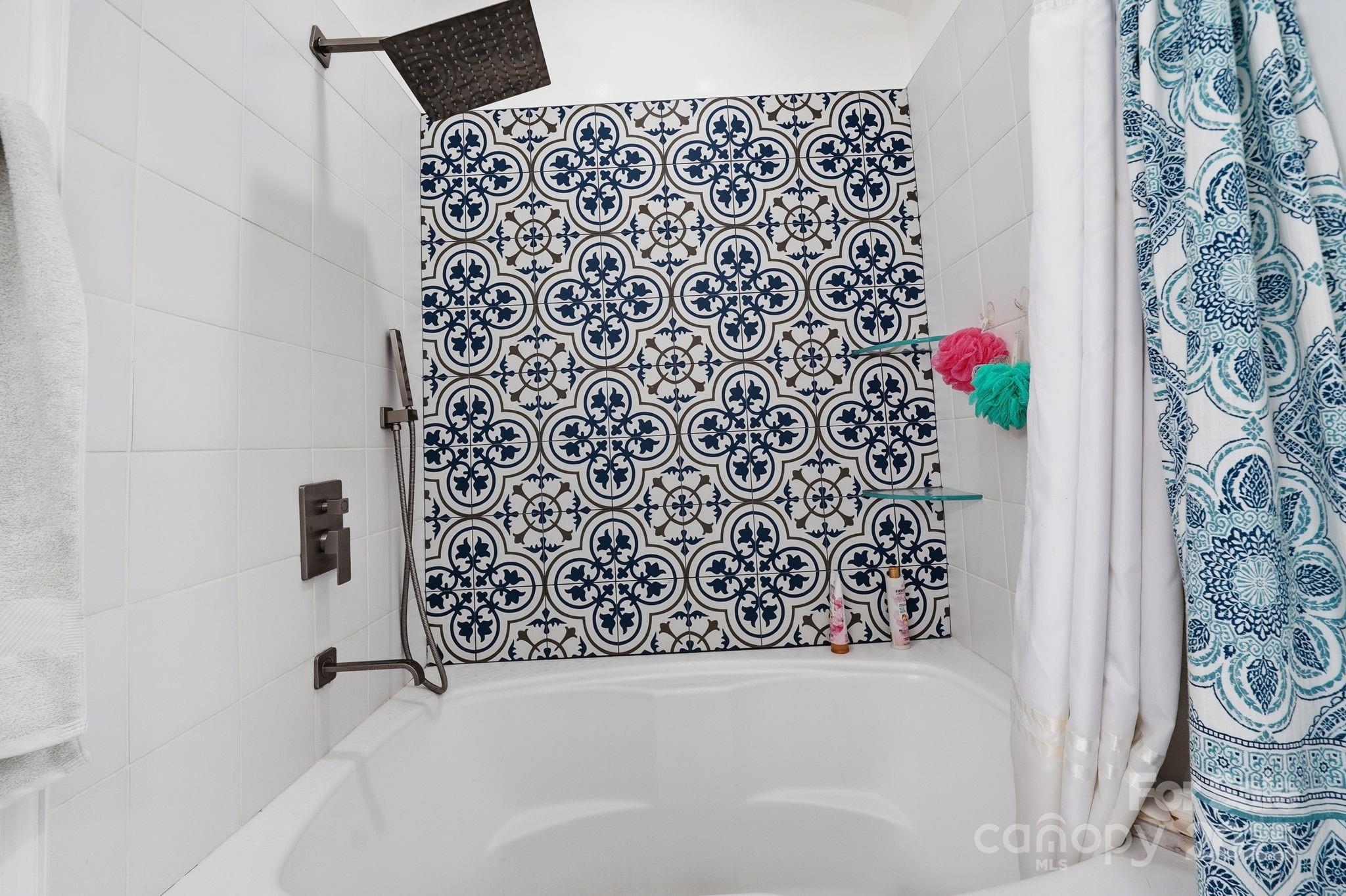 13512 Michael Lynn Road Charlotte, NC 28278 - Photo 23 of 36 a bathroom with a bathtub and shower