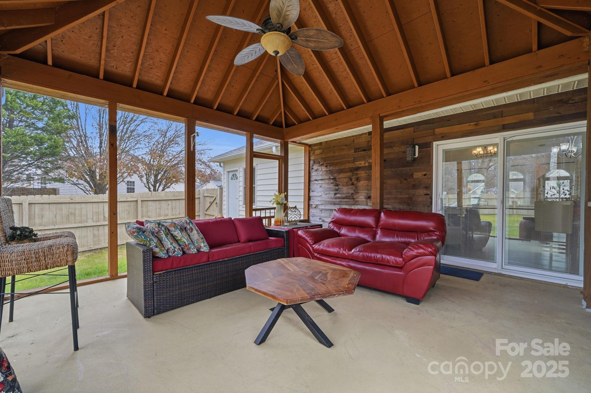 13512 Michael Lynn Road Charlotte, NC 28278 - Photo 27 of 36 a living room with furniture a flat screen tv and a large window