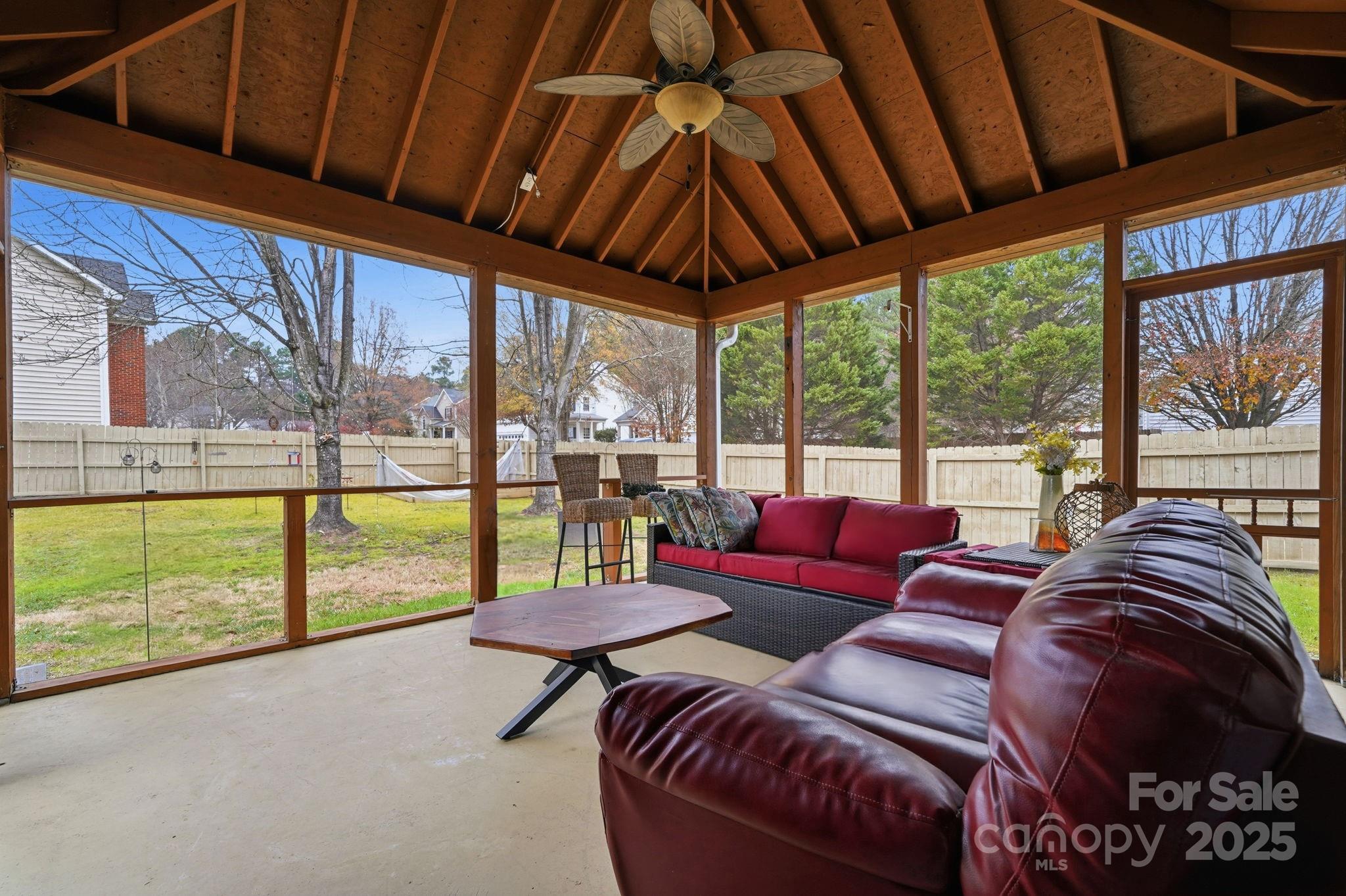 13512 Michael Lynn Road Charlotte, NC 28278 - Photo 28 of 36 a living room with furniture and a floor to ceiling window