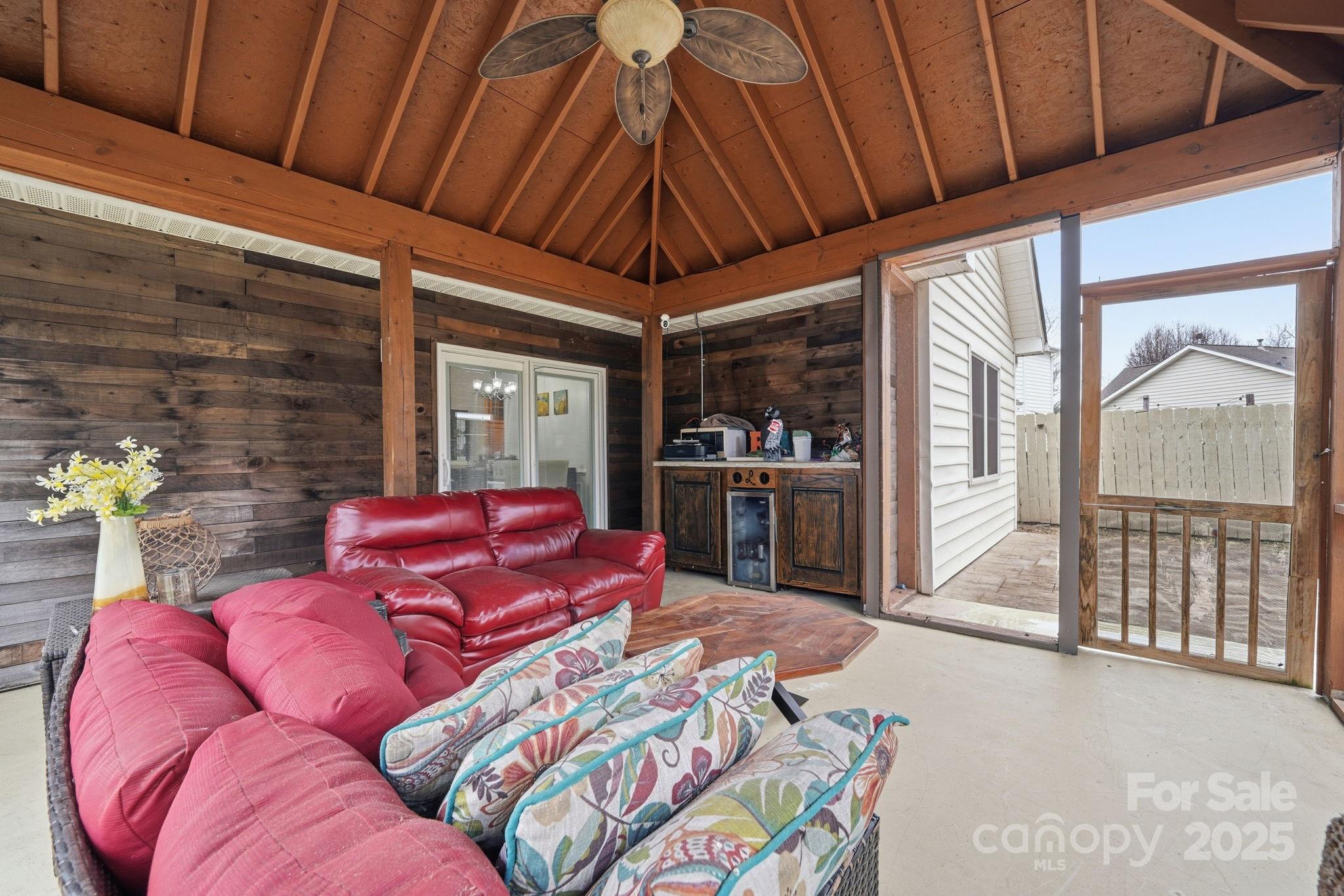 13512 Michael Lynn Road Charlotte, NC 28278 - Photo 29 of 36 a living room with furniture a flat screen tv and next to a window