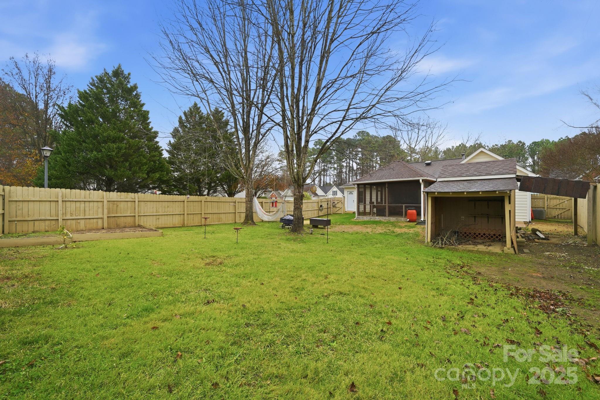 13512 Michael Lynn Road Charlotte, NC 28278 - Photo 32 of 36 a view of a house with a backyard