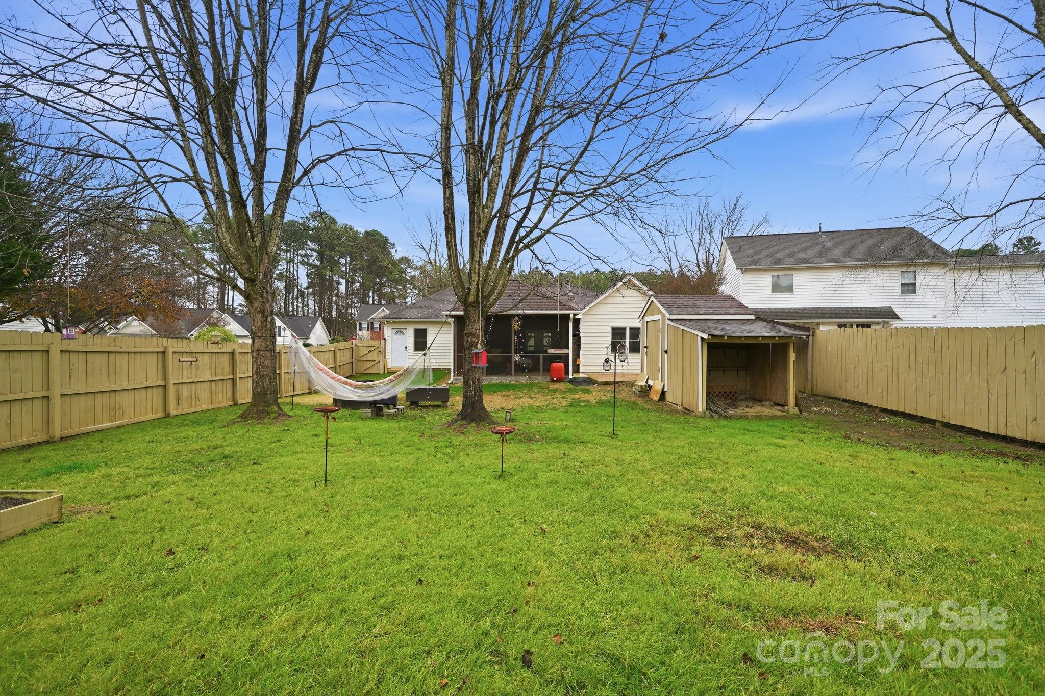 13512 Michael Lynn Road Charlotte, NC 28278 - Photo 33 of 36 a white house that has a tree in front of it