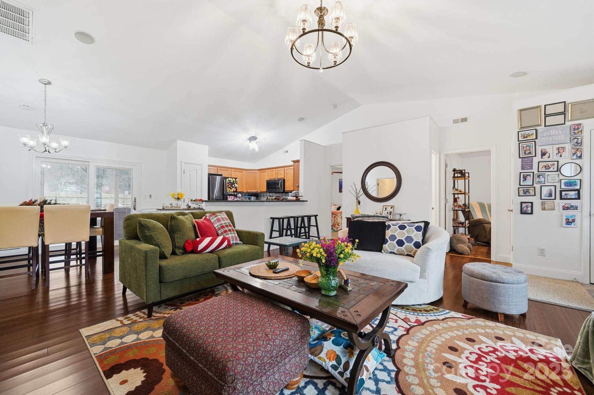 13512 Michael Lynn Road Charlotte, NC 28278 - Photo 10 of 36 a living room with furniture kitchen view and a chandelier