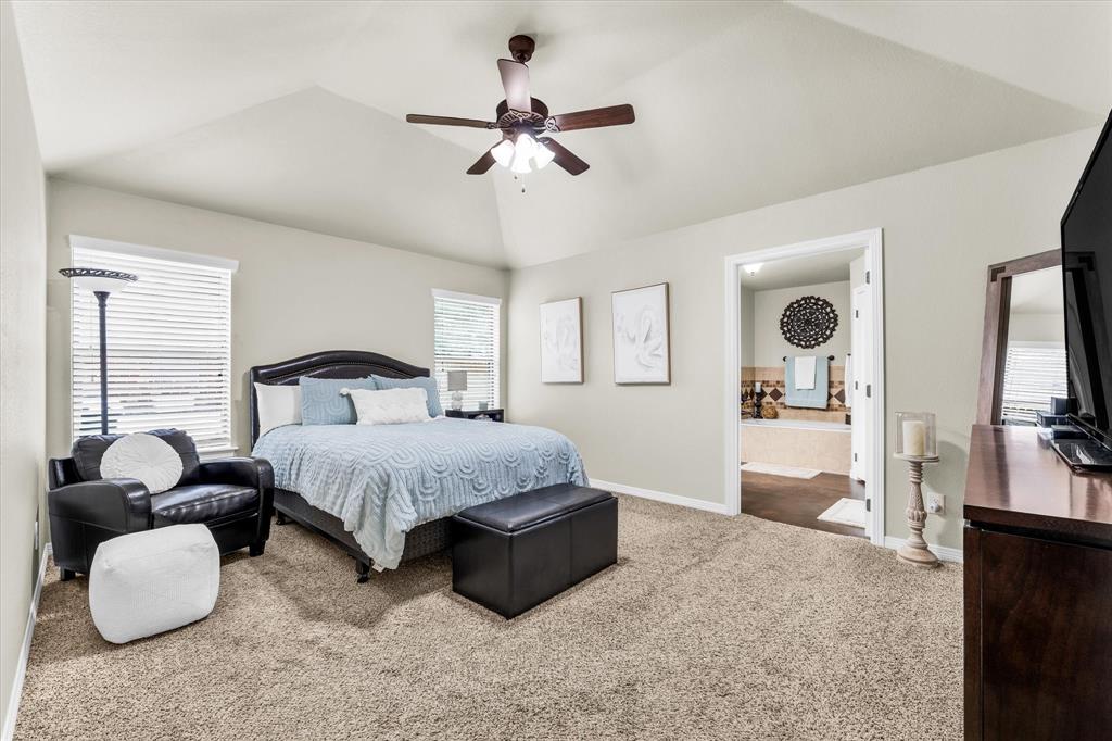 814 Springdale Circle Lorena, TX 76655 - Photo 18 of 37 Spacious room featuring vaulted ceilings, a ceiling fan with integrated lighting, and carpet flooring