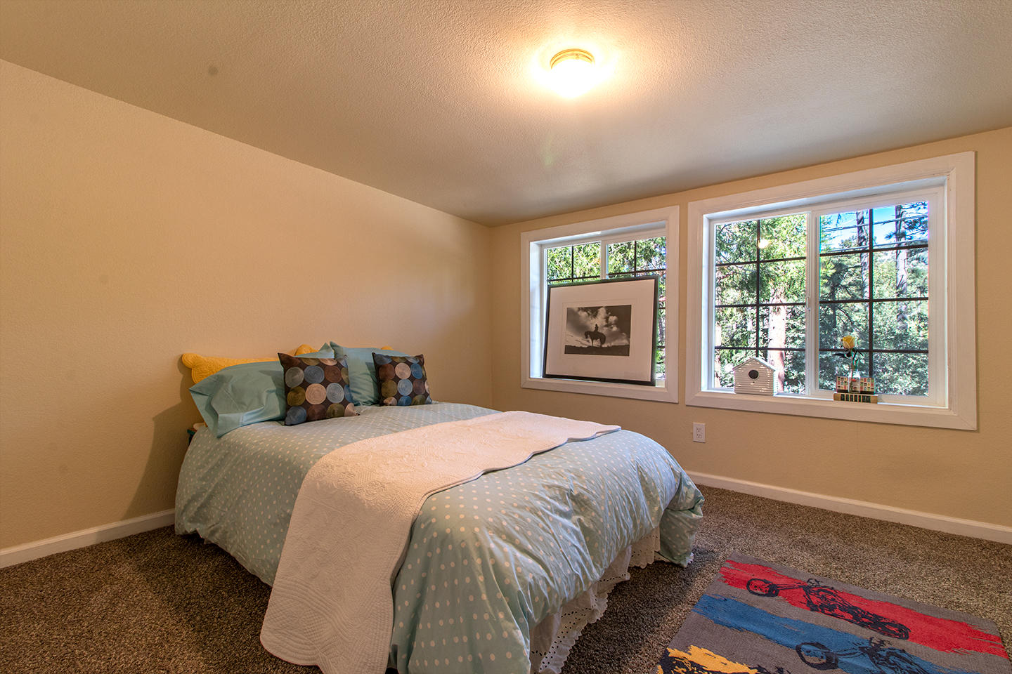 53475 Tollgate Road Idyllwild, CA 92549 - Photo 23 of 46 a bed sitting in a bedroom next to a window