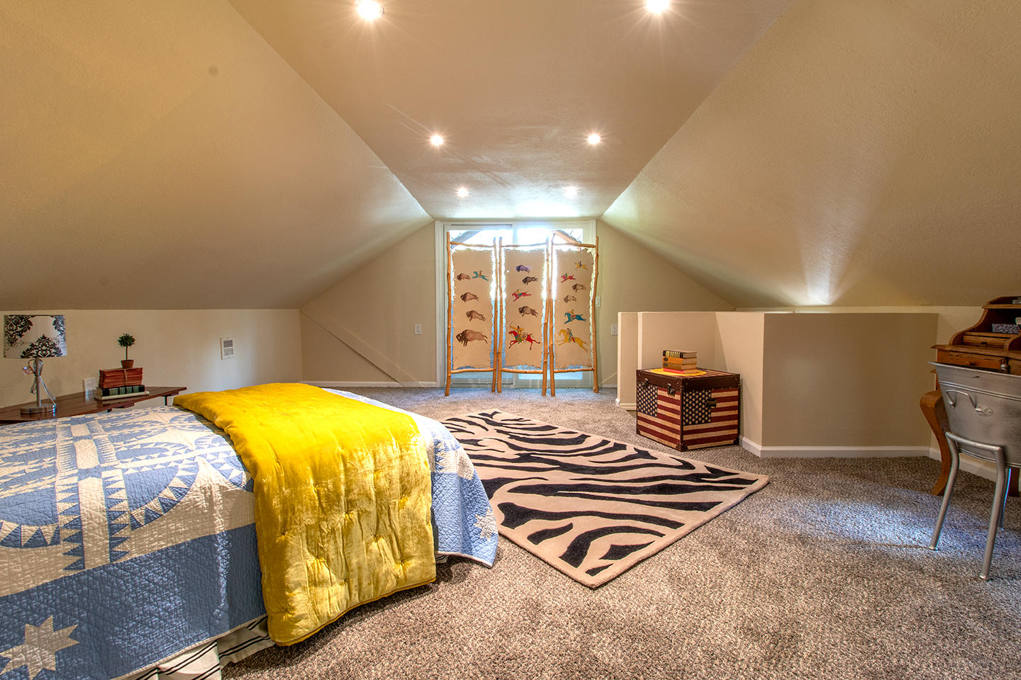 53475 Tollgate Road Idyllwild, CA 92549 - Photo 36 of 46 a bedroom with a bed and a chandelier
