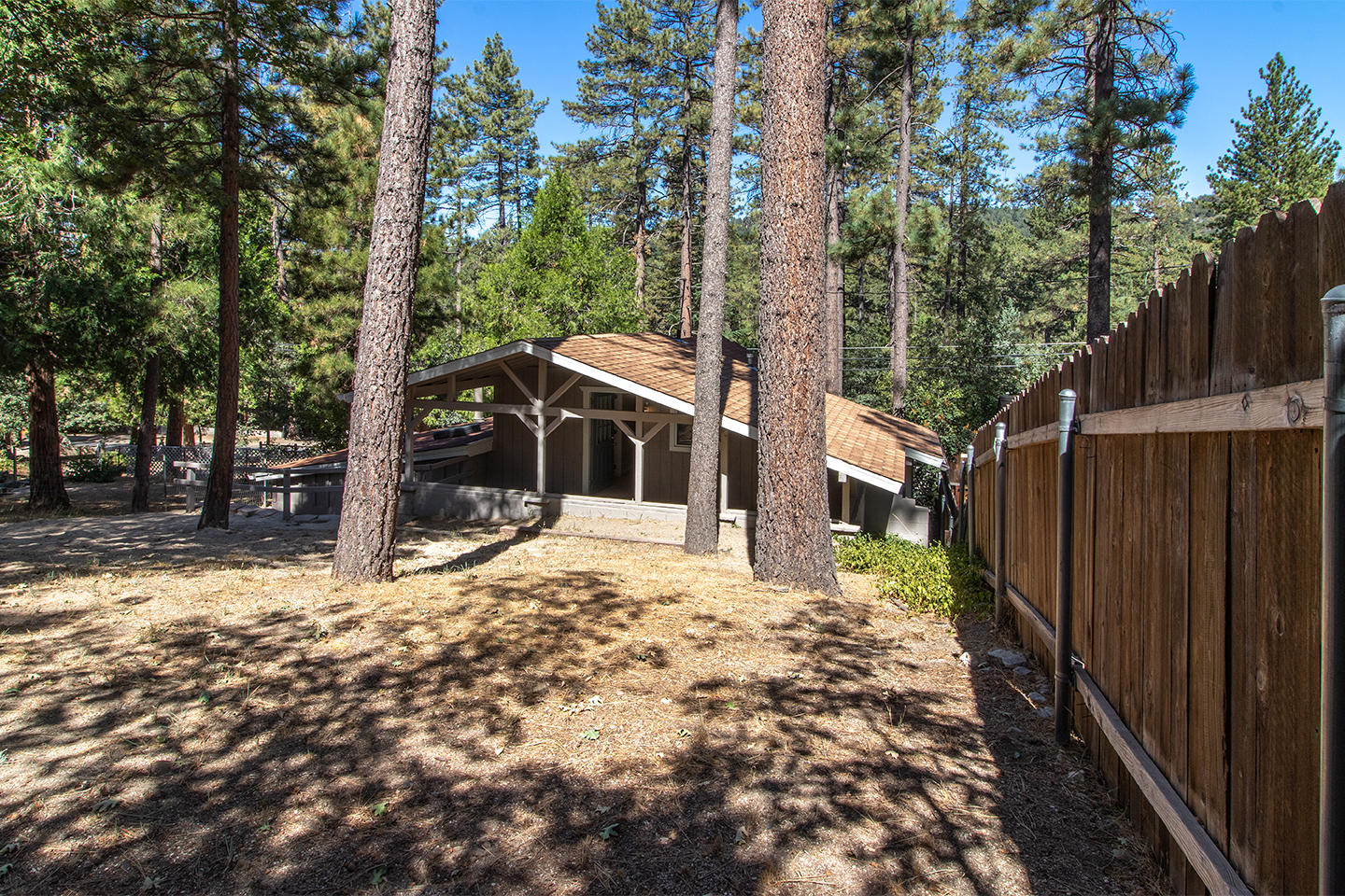 53475 Tollgate Road Idyllwild, CA 92549 - Photo 44 of 46 a yellow house with trees in front of it