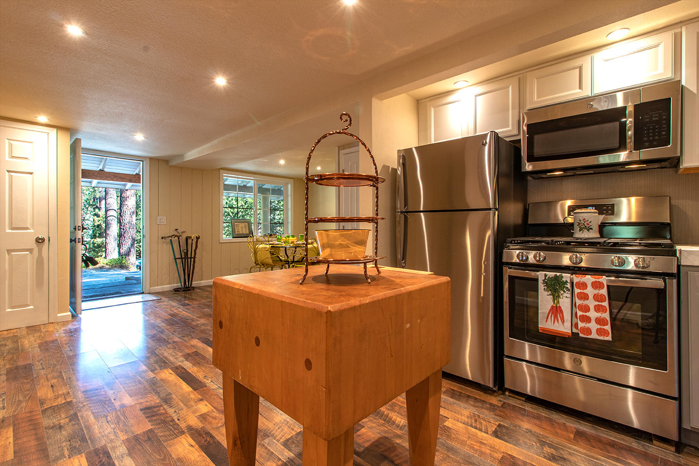 53475 Tollgate Road Idyllwild, CA 92549 - Photo 9 of 46 a kitchen with stainless steel appliances granite countertop a refrigerator a stove a sink and a microwave