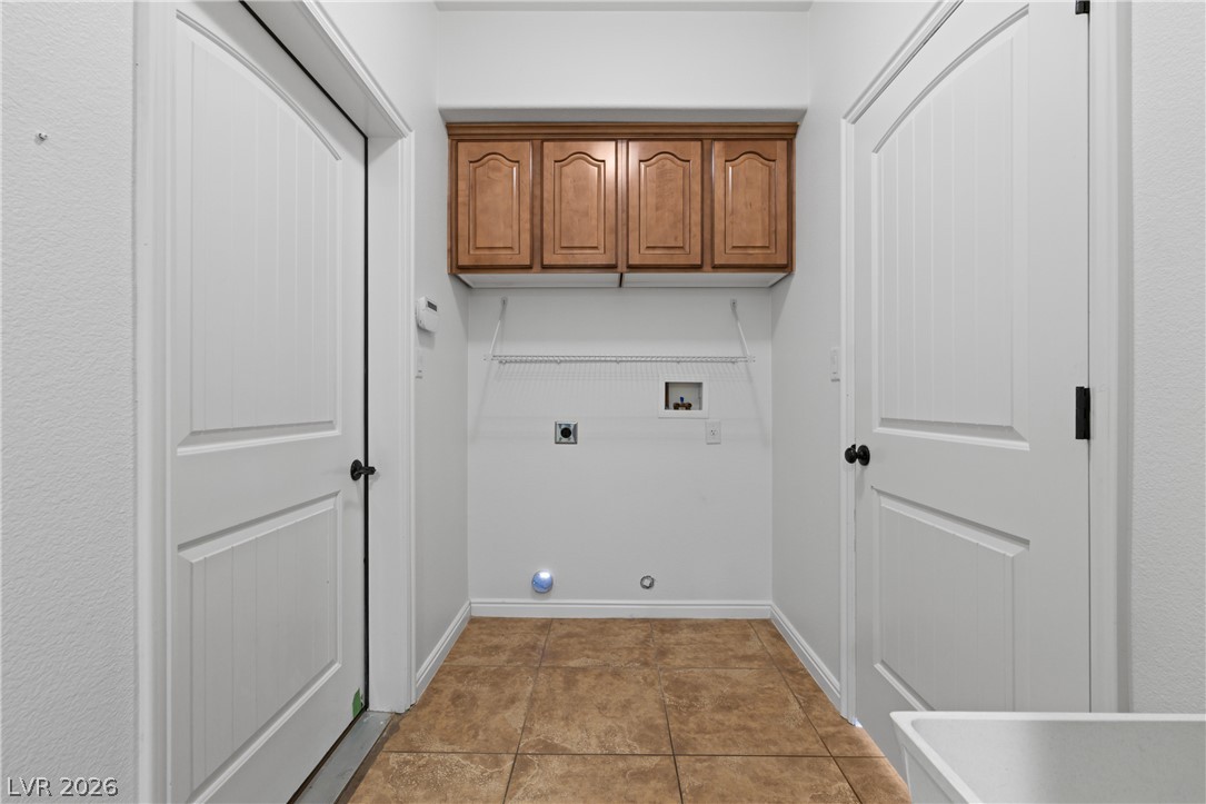 575 Gann Avenue Logandale, NV 89021 - Photo 27 of 75 Ample cabinetry provides smart storage in this functional laundry space.