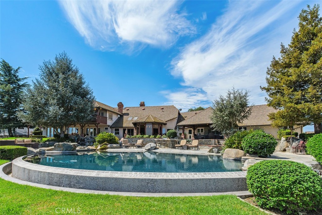 27777 Sycamore Mesa Road Temecula, CA 92590 - Photo 42 of 72 Infinity edge pool with beach entry, waterfall, spa and lounging deck