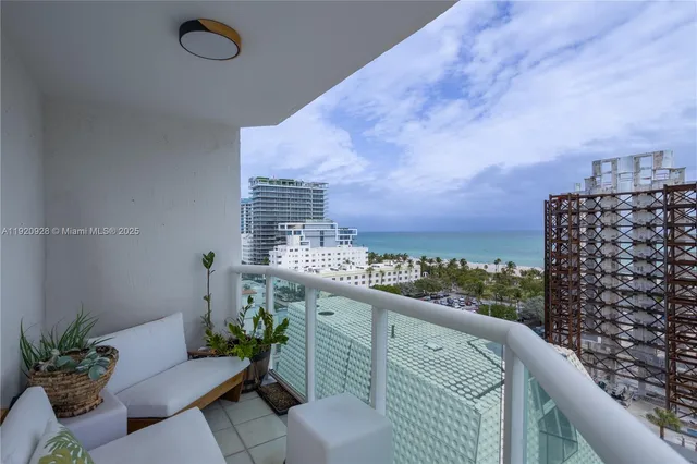 a balcony with a potted plant