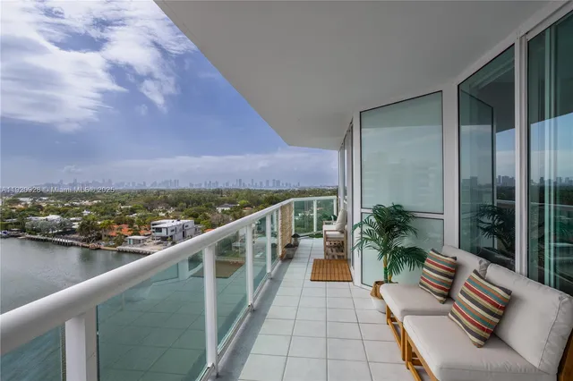 a view of balcony with furniture