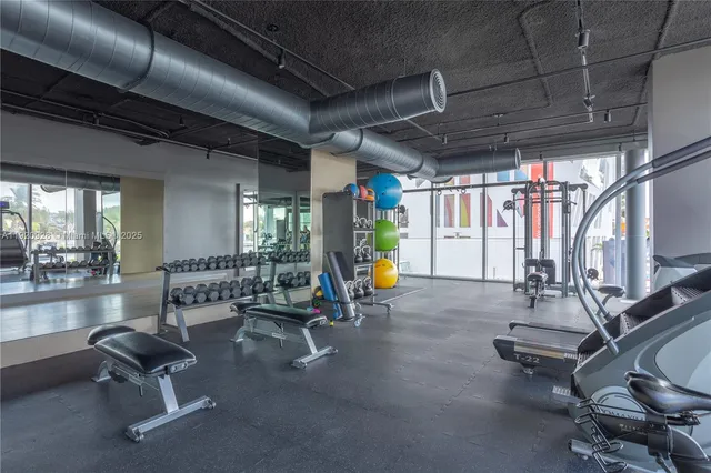 a view of hallway with wooden floor