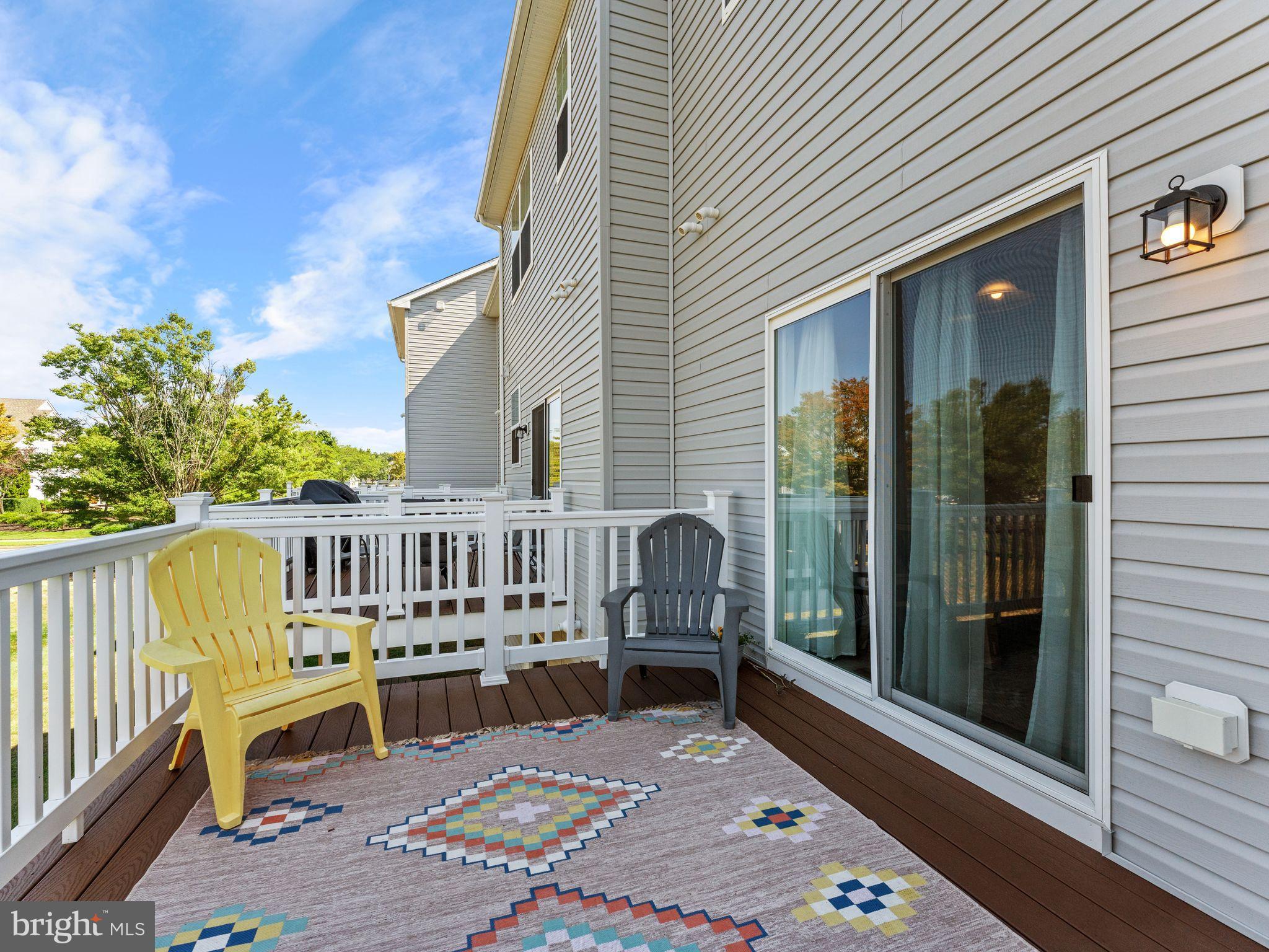 14 Aviary Road West Deptford, NJ 08086 - Photo 33 of 39 a view of a chair and tables in the balcony