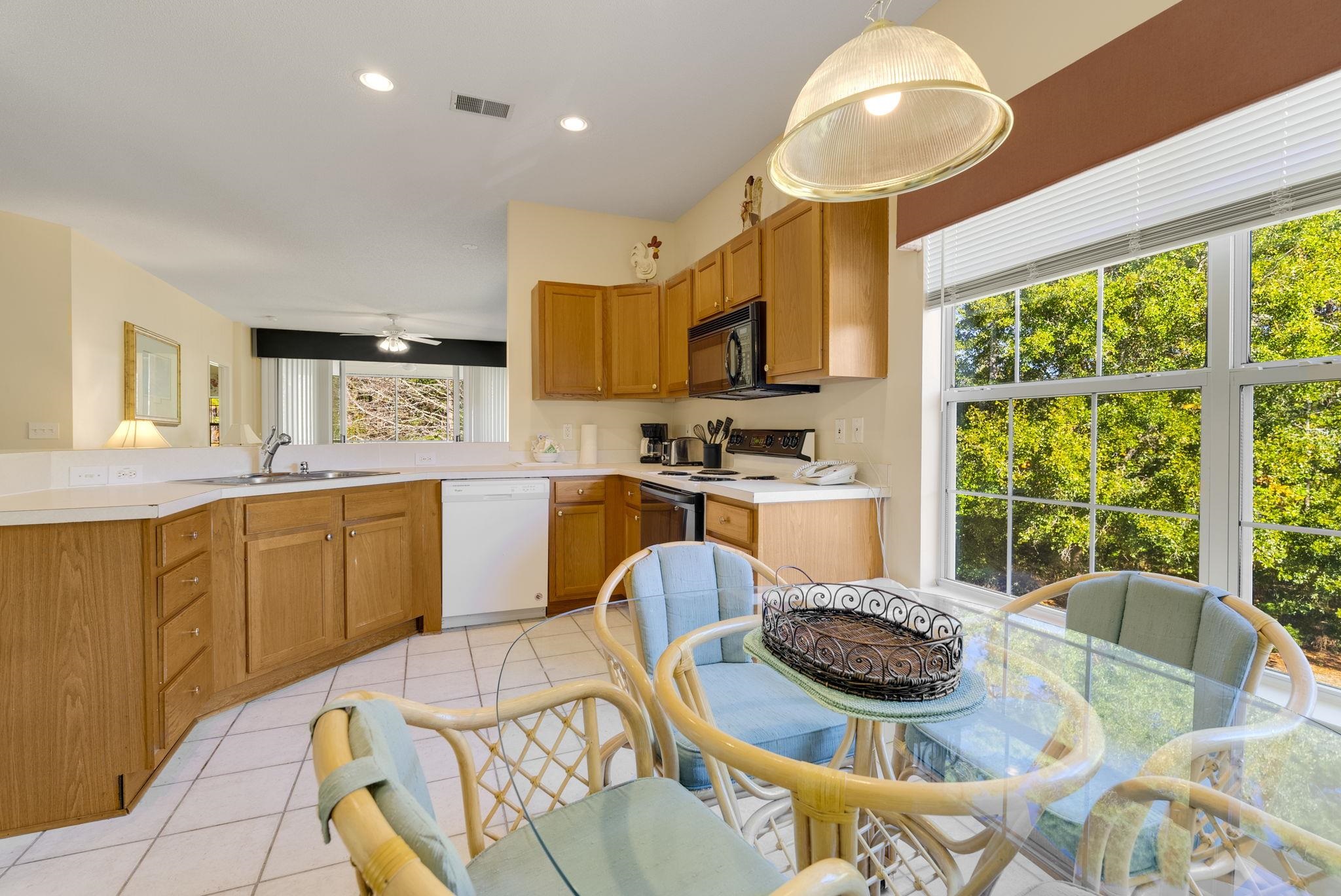 4499 Girvan Drive, Unit H Myrtle Beach, SC 29579 - Photo 20 of 35 Kitchen featuring light countertops, range with electric stovetop, white dishwasher, light tile patterned floors, and recessed lighting